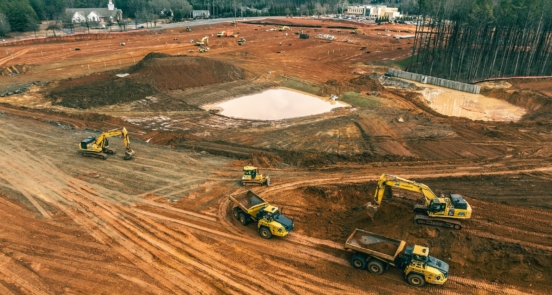 Magnum Contracting crews performing mass grading and earthwork on a commercial site